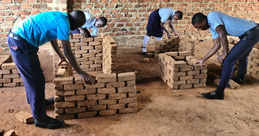 Shared Love Uganda Vocational Training in break laying and concrete practice